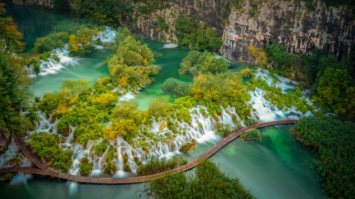 Walkway over a lake with waterfalls - Plitvice, Croatia