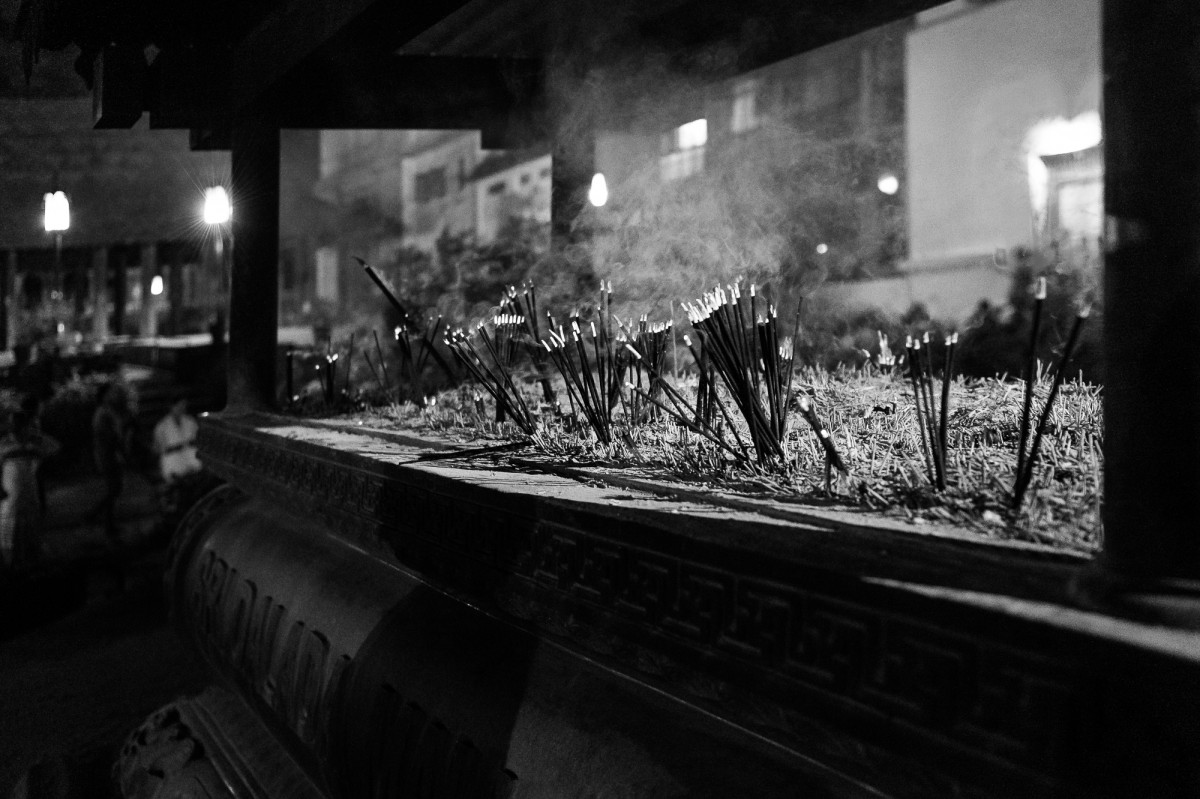 Incense sticks in an altar at the Temple of the Tooth - Kandy, Sri Lanka