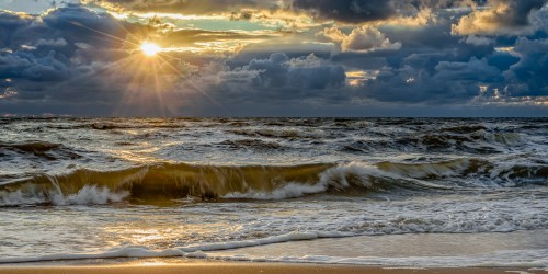 Clouded sunset over a rough sea - Katwijk, The Netherlands